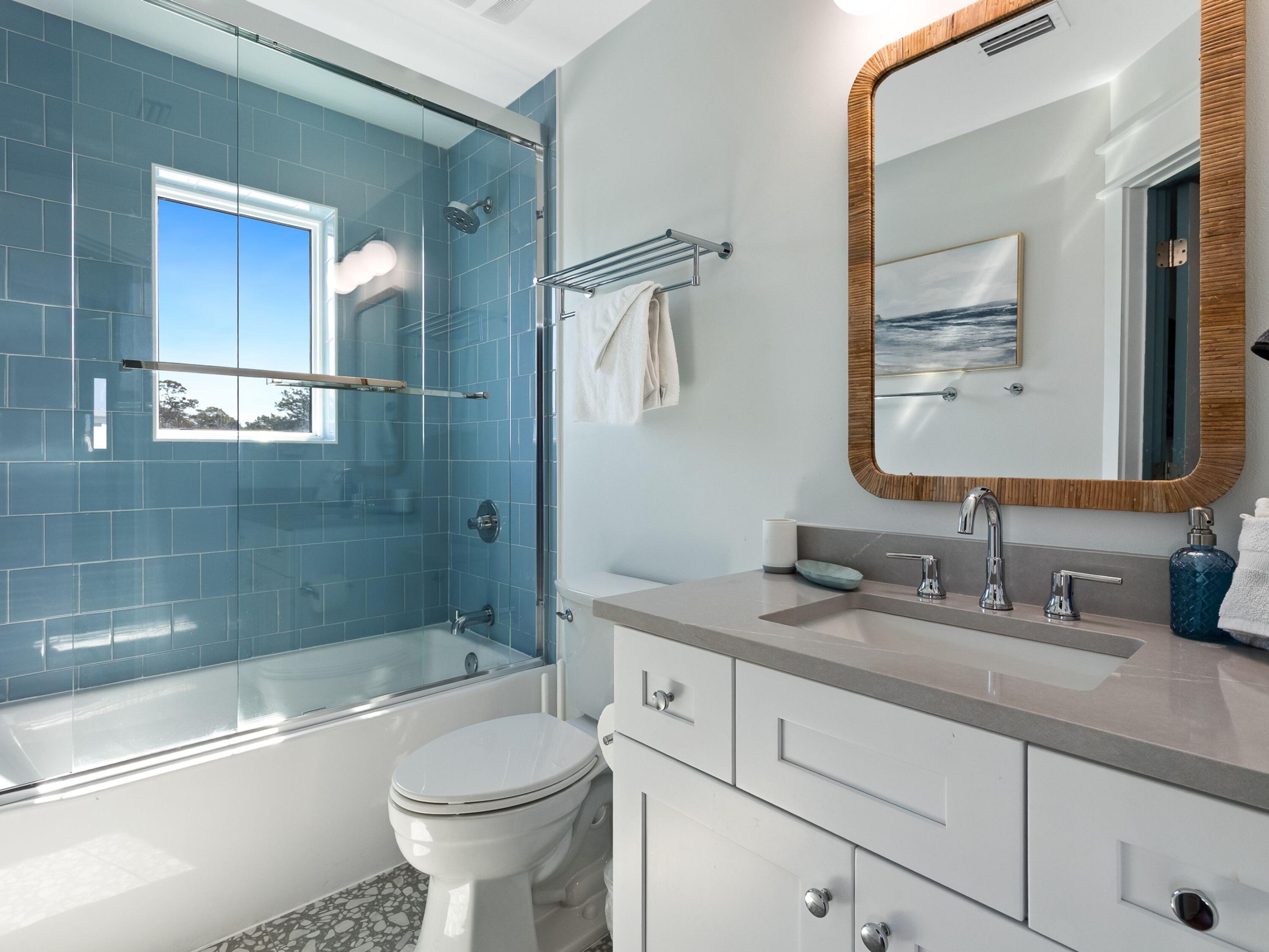183 Walnut Street Santa Rosa Beach, FL 32459 - Photo 33 of 71 a bathroom with a granite countertop toilet sink and shower