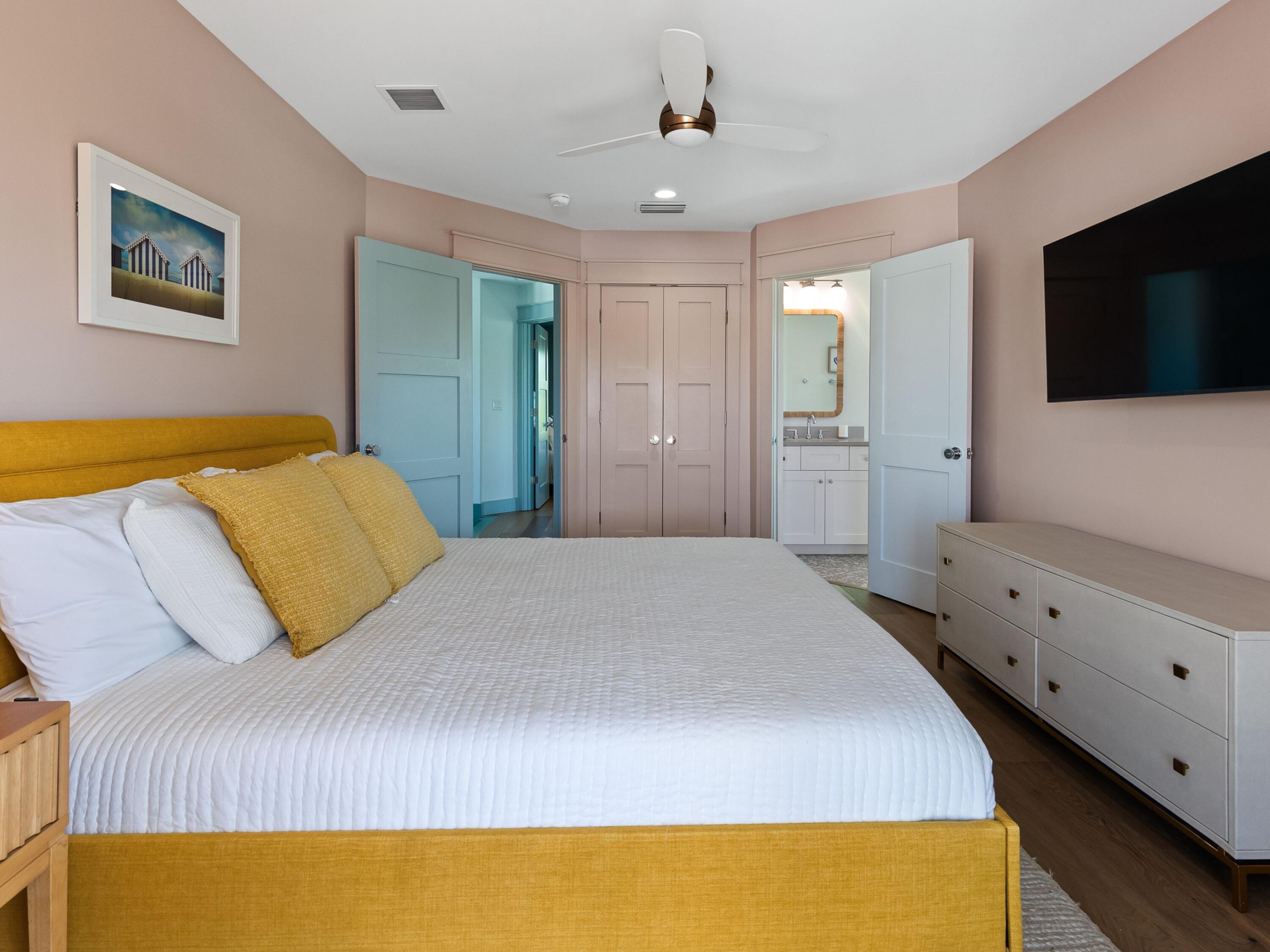 183 Walnut Street Santa Rosa Beach, FL 32459 - Photo 34 of 71 a bedroom with a bed and a flat screen tv