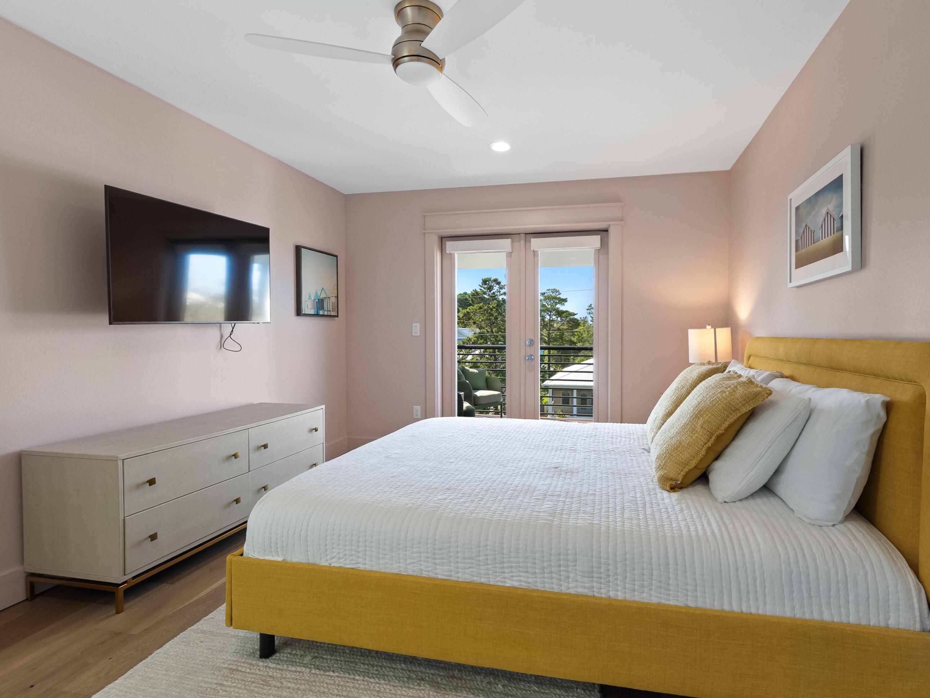 183 Walnut Street Santa Rosa Beach, FL 32459 - Photo 36 of 71 a bedroom with a bed and a flat screen tv