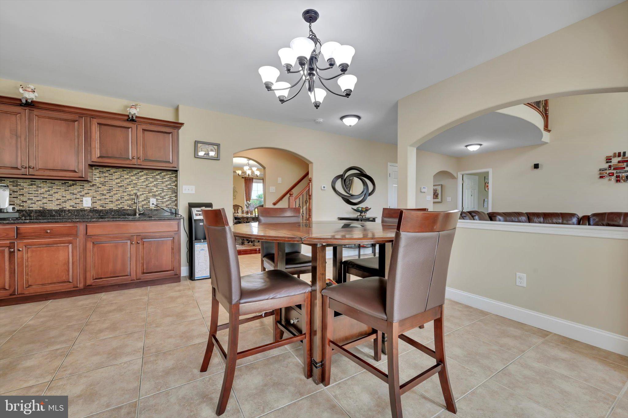 118 Connecticut Avenue Sinking Spring, PA 19608 - Photo 14 of 61 a view of a dining room and a kitchen with a table and chairs