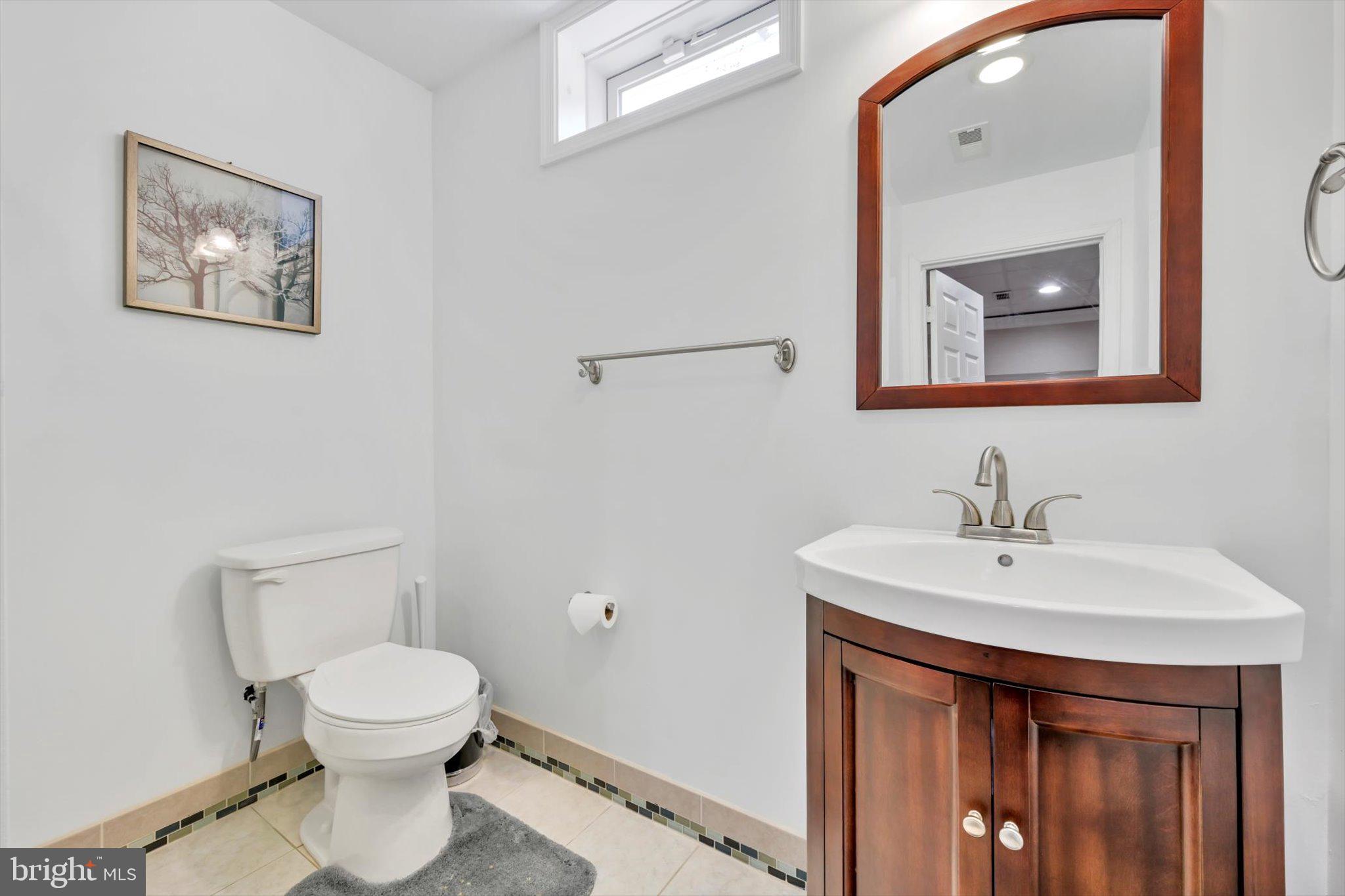 118 Connecticut Avenue Sinking Spring, PA 19608 - Photo 40 of 61 a bathroom with a toilet a sink and mirror