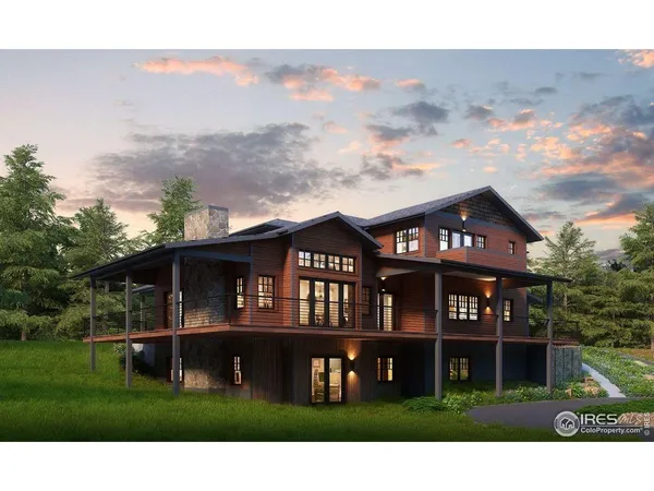 a view of a white house with a big yard and large trees