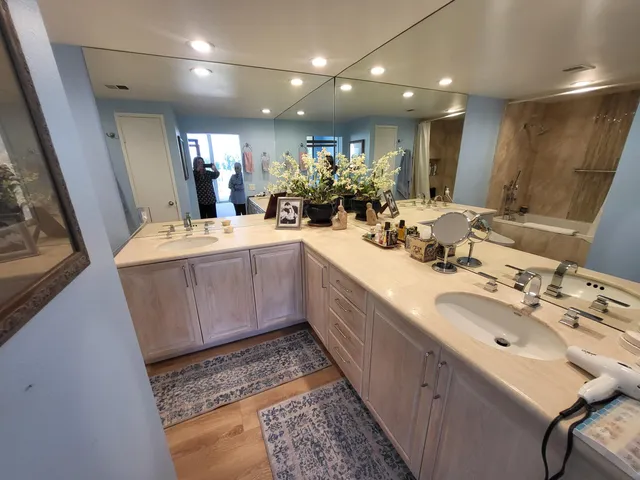 a bathroom with sink mirror and vanity