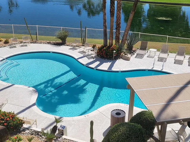 a view of swimming pool from a balcony