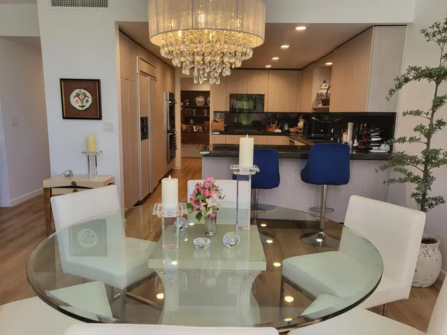 a kitchen with a dining table and chairs