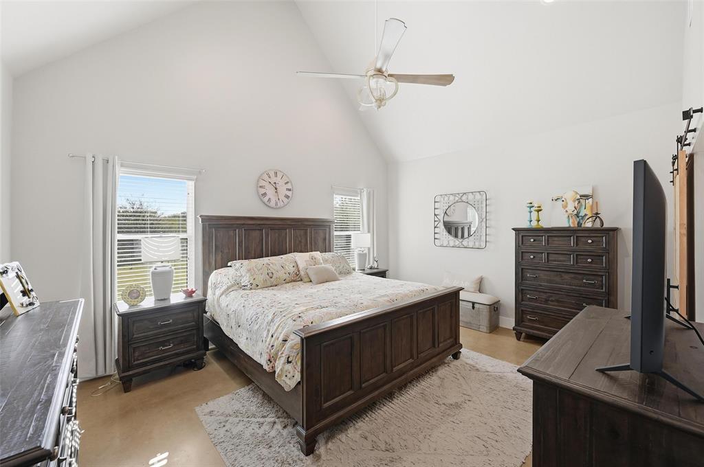 350 Rolling Rnch Boulevard Alvord, TX 76225 - Photo 11 of 30 a bedroom with a bed and a night stand