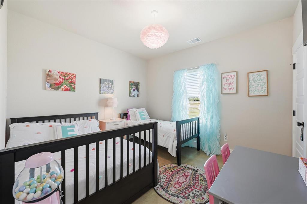 350 Rolling Rnch Boulevard Alvord, TX 76225 - Photo 15 of 30 a bedroom with furniture and a bed