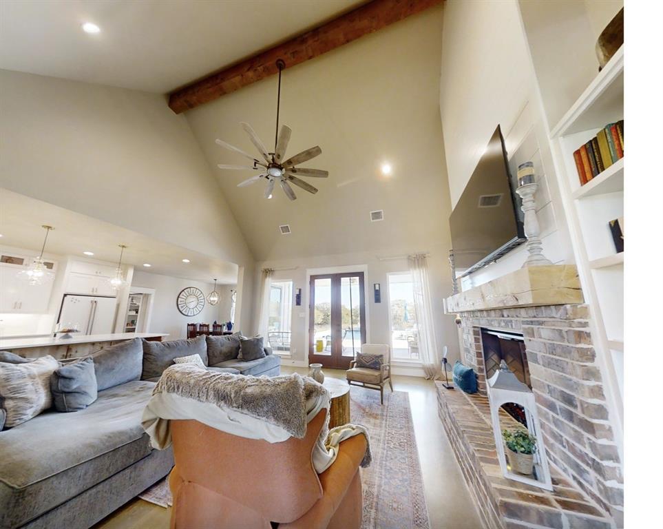 350 Rolling Rnch Boulevard Alvord, TX 76225 - Photo 19 of 30 a living room with furniture and a fireplace