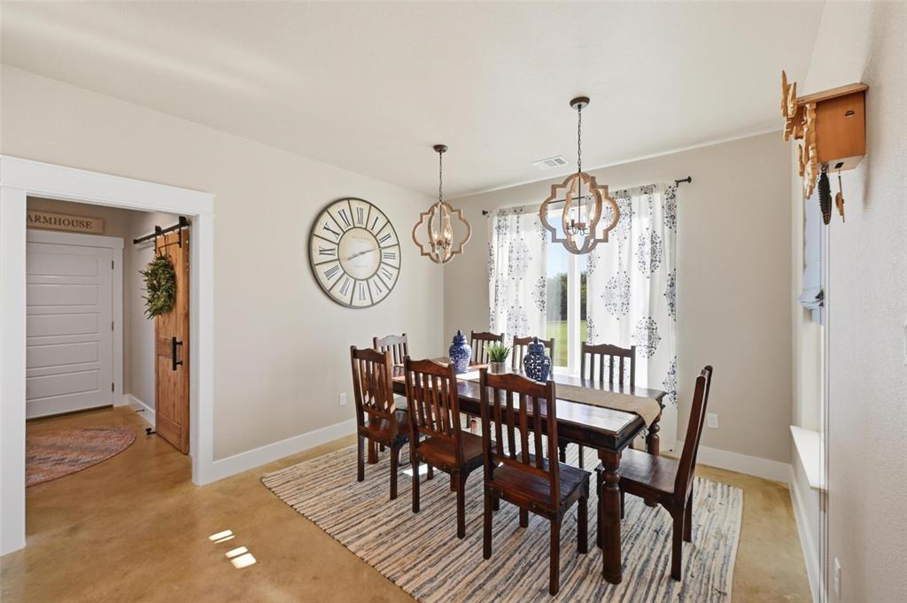 350 Rolling Rnch Boulevard Alvord, TX 76225 - Photo 21 of 30 a view of a dining room with furniture window and wooden floor