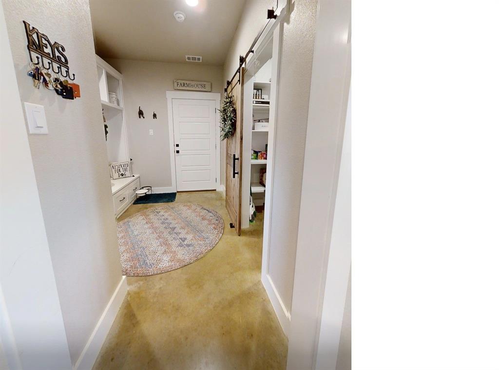 350 Rolling Rnch Boulevard Alvord, TX 76225 - Photo 25 of 30 a view of a hallway view with staircase
