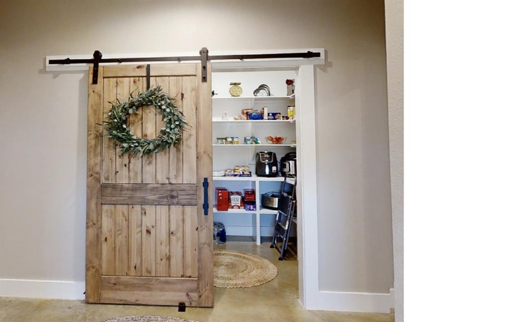 350 Rolling Rnch Boulevard Alvord, TX 76225 - Photo 26 of 30 a view of walk in closet with clothes and shoes