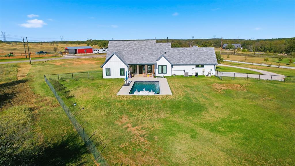 350 Rolling Rnch Boulevard Alvord, TX 76225 - Photo 29 of 30 a view of a big yard with an ocean view