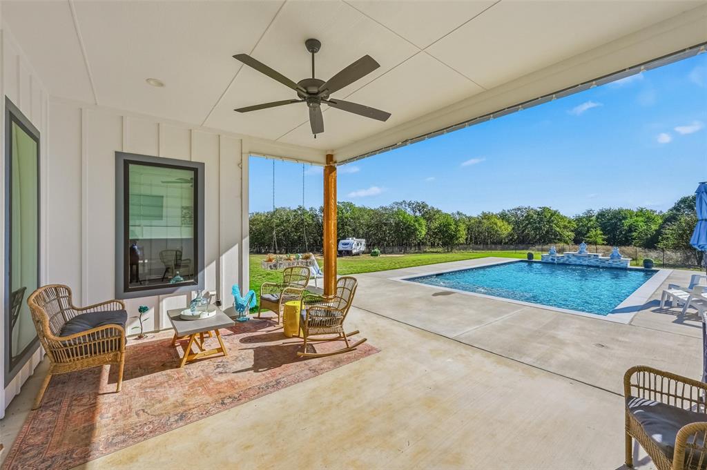 350 Rolling Rnch Boulevard Alvord, TX 76225 - Photo 4 of 30 a swimming pool with outdoor seating and yard
