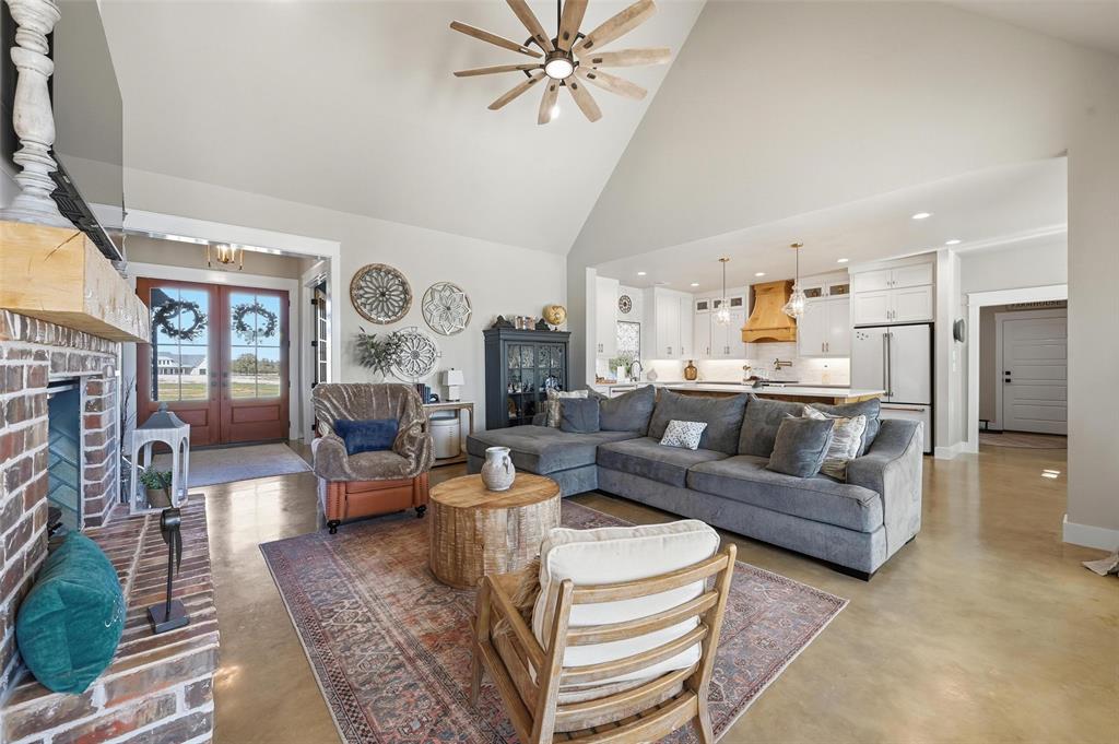 350 Rolling Rnch Boulevard Alvord, TX 76225 - Photo 8 of 30 a living room with fireplace furniture and a rug