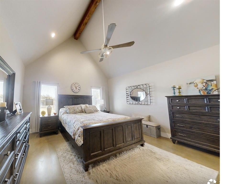 350 Rolling Rnch Boulevard Alvord, TX 76225 - Photo 10 of 30 a bedroom with a bed and a chandelier