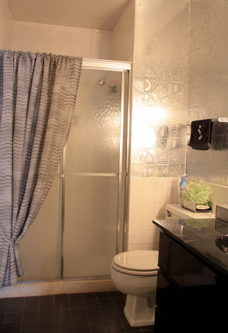 6033 North Sheridan Road, Unit 37K Chicago, IL 60660 - Photo 12 of 18 a bathroom with a sink a toilet and shower