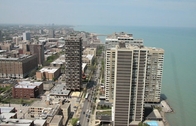 6033 North Sheridan Road, Unit 37K Chicago, IL 60660 - Photo 3 of 18 a view of a city with tall buildings