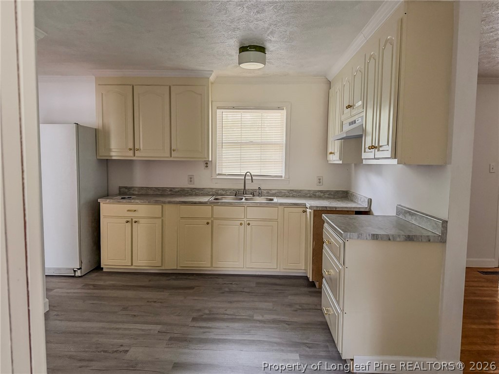 598 Forest Road Lumberton, NC 28358 - Photo 3 of 25 a kitchen with a sink stove top oven and cabinets