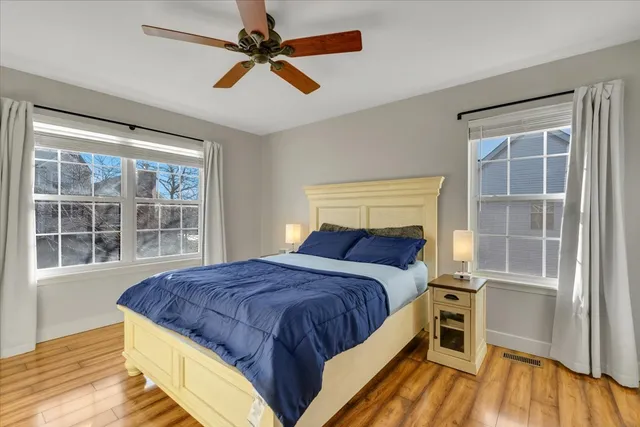 a bedroom with a large bed and a window