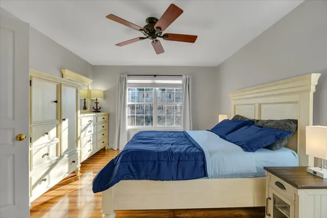 a bedroom with a large bed and a window