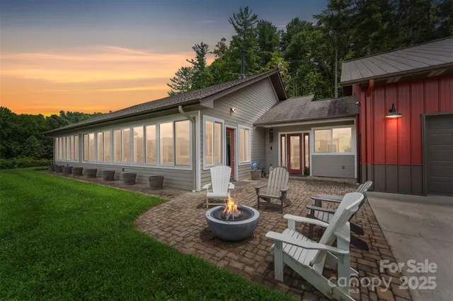 a backyard of a house with yard barbeque oven and outdoor seating