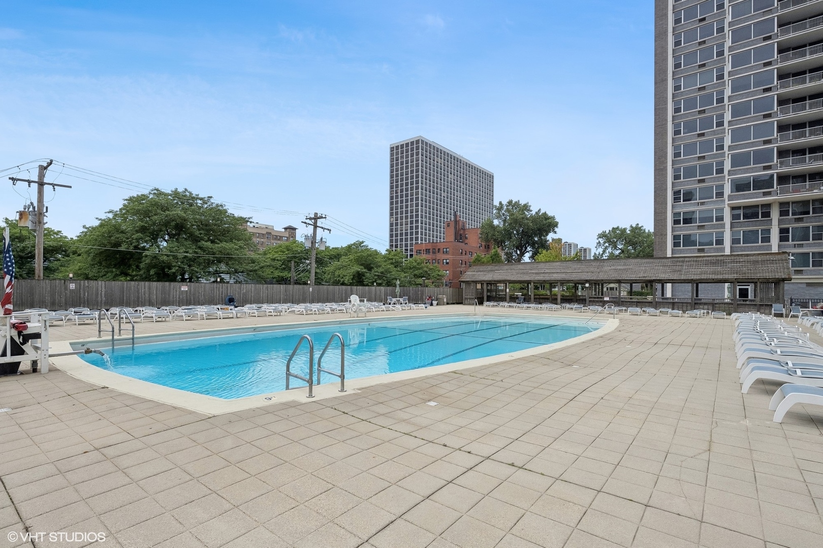 4250 North Marine Drive, Unit 2115 Chicago, IL 60613 - Photo 20 of 24 a view of a swimming pool and a back yard