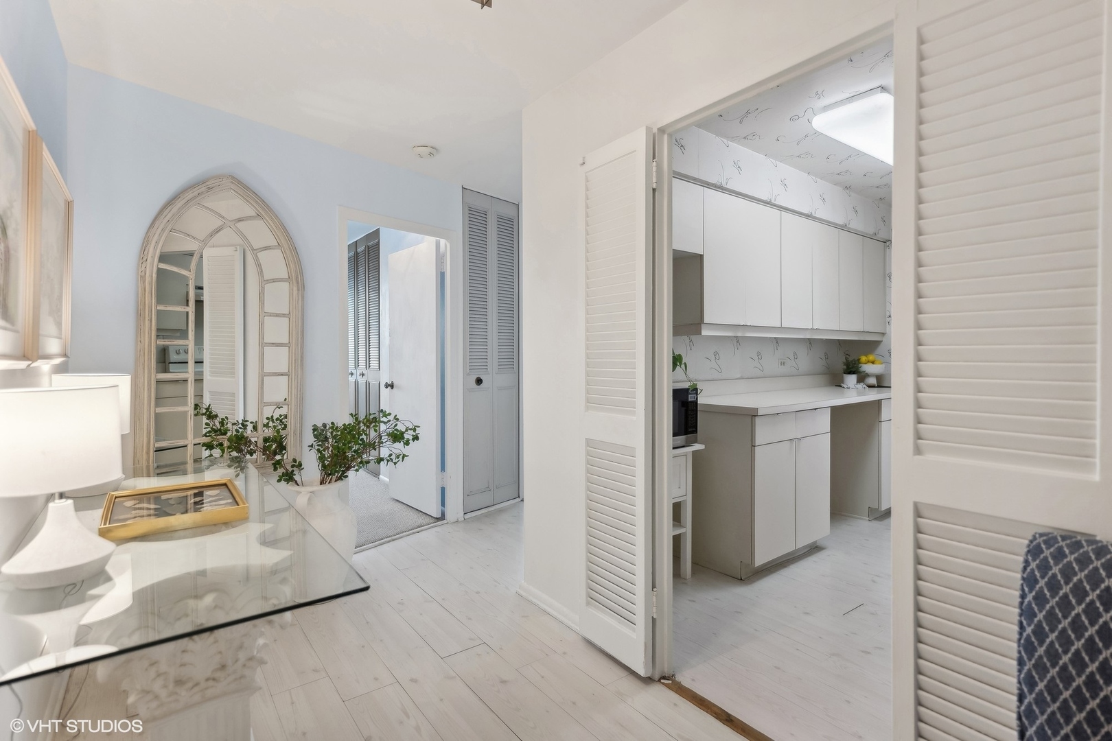 4250 North Marine Drive, Unit 2115 Chicago, IL 60613 - Photo 3 of 24 a view of a kitchen cabinets and a living room
