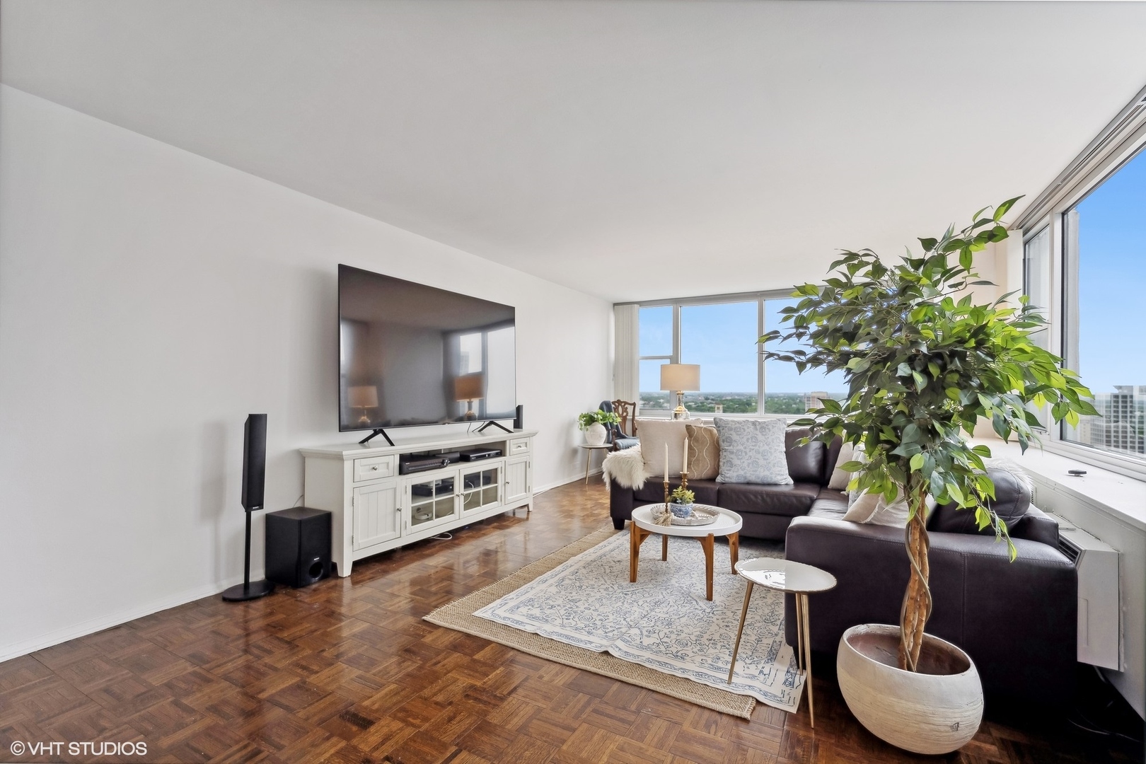 4250 North Marine Drive, Unit 2115 Chicago, IL 60613 - Photo 5 of 24 a living room with furniture and a flat screen tv