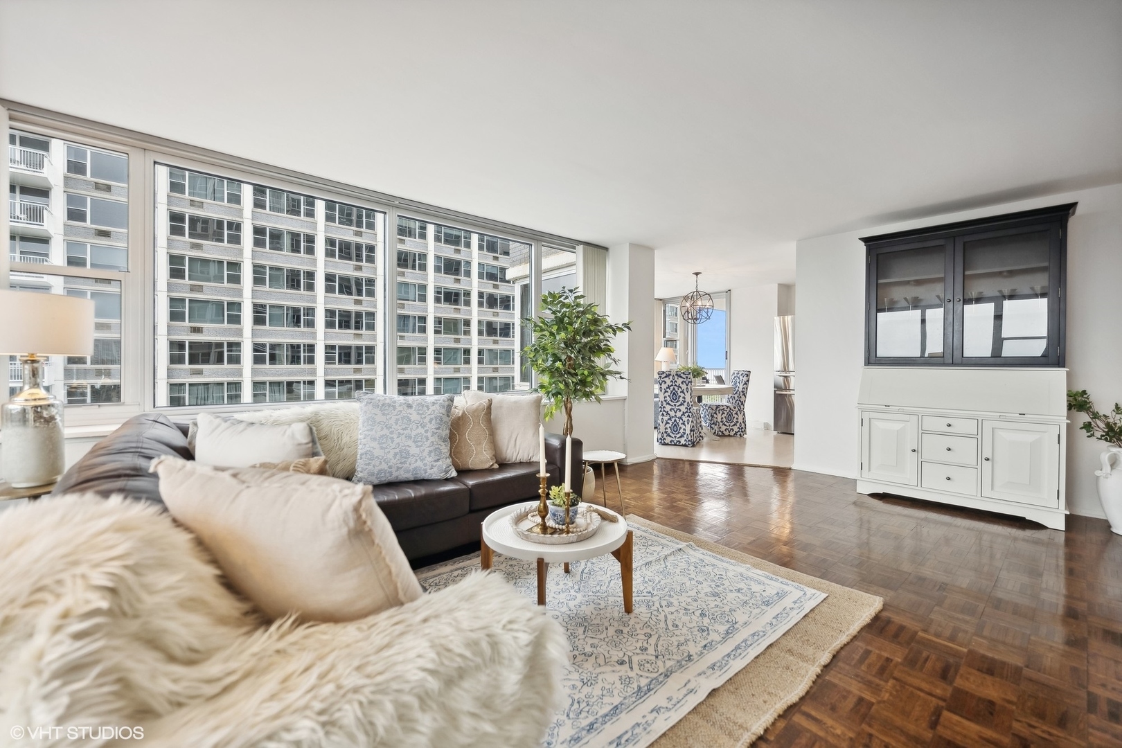 4250 North Marine Drive, Unit 2115 Chicago, IL 60613 - Photo 6 of 24 a living room with furniture and a large window