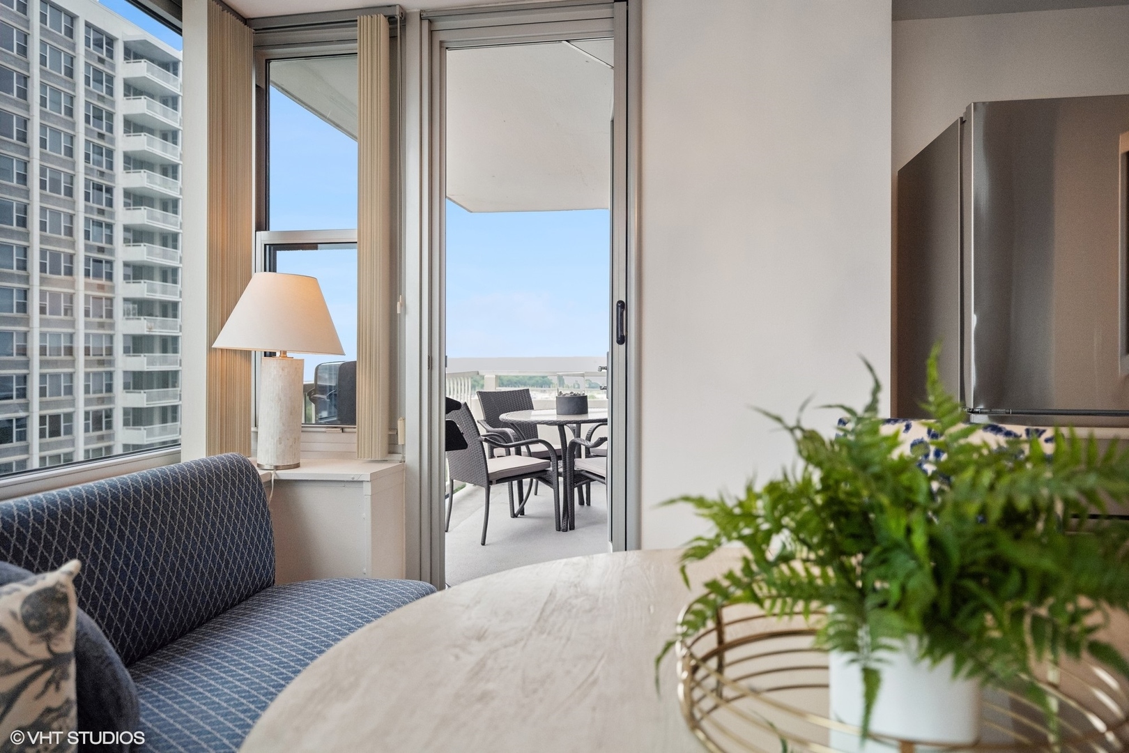 4250 North Marine Drive, Unit 2115 Chicago, IL 60613 - Photo 8 of 24 a bedroom with a bed and a chandelier