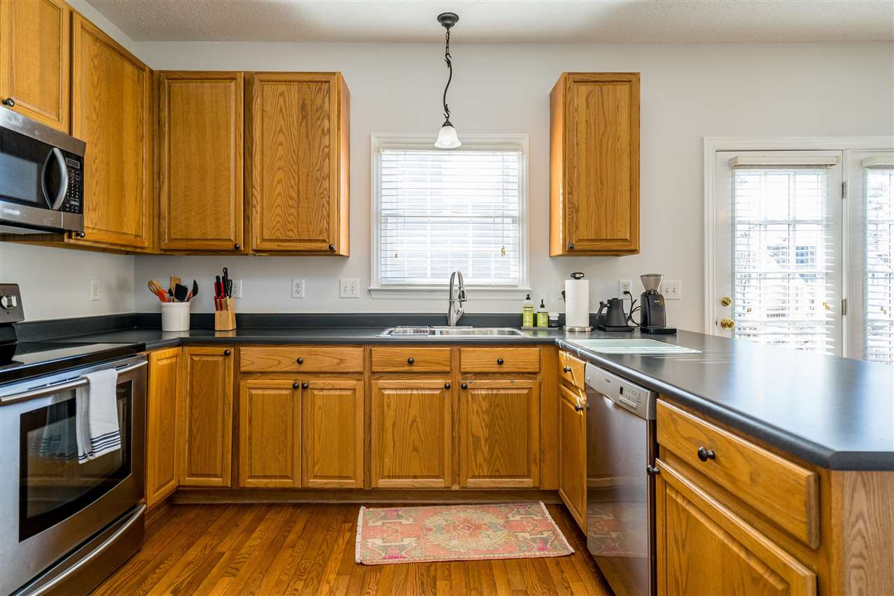 5221 Denmead Way Raleigh, NC 27613 - Photo 13 of 28 Clean kitchen with stainless steel appliances and open concept! Kitchen