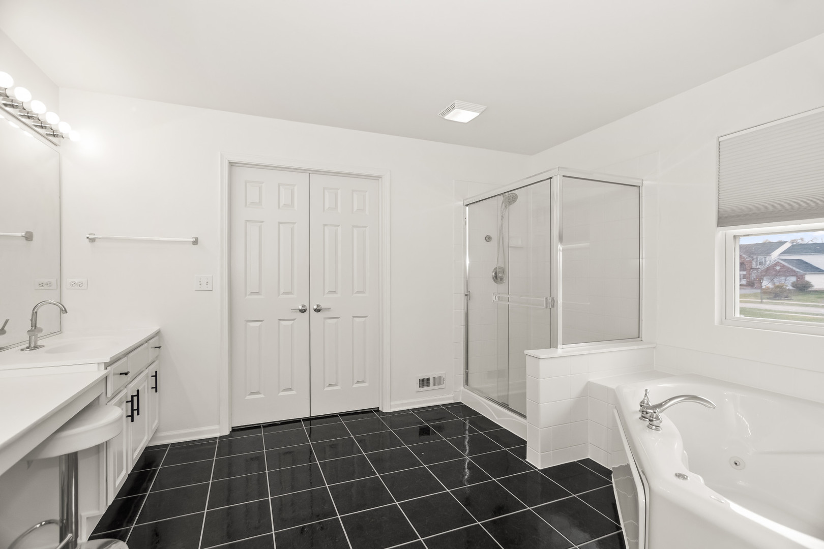 282 Crabapple Street Bolingbrook, IL 60490 - Photo 14 of 23 a bathroom with a bathtub a mirror a sink and a shower