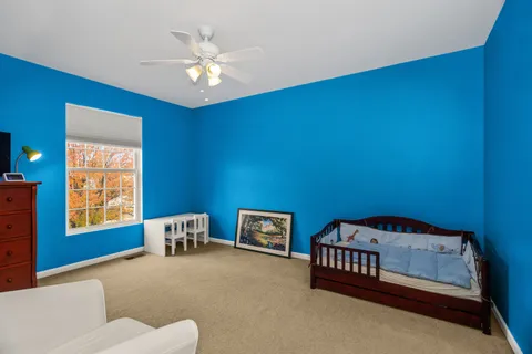 a bedroom with furniture and a window