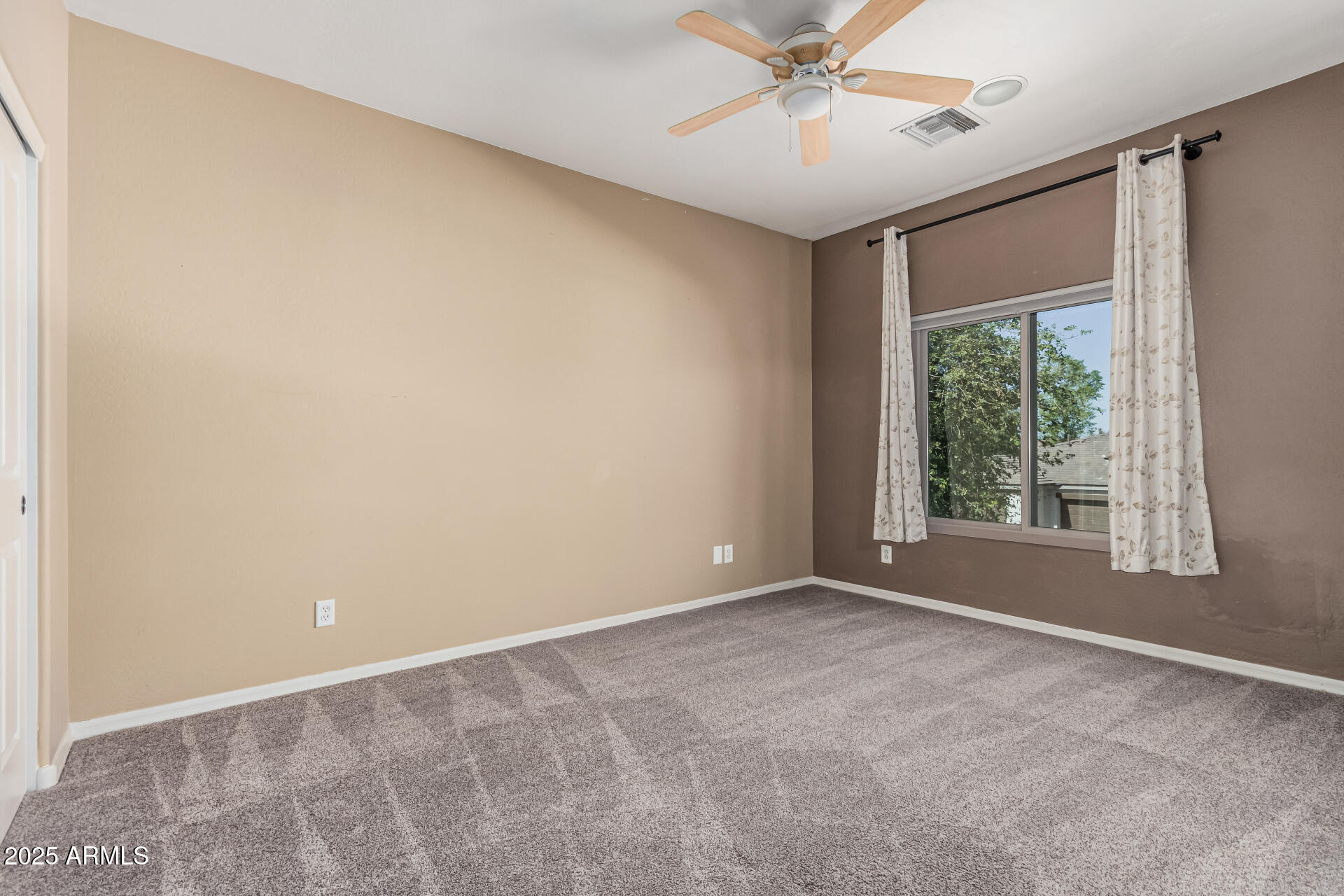 5752 South Crossbow Place Chandler, AZ 85249 - Photo 29 of 51 a view of an empty room with a window