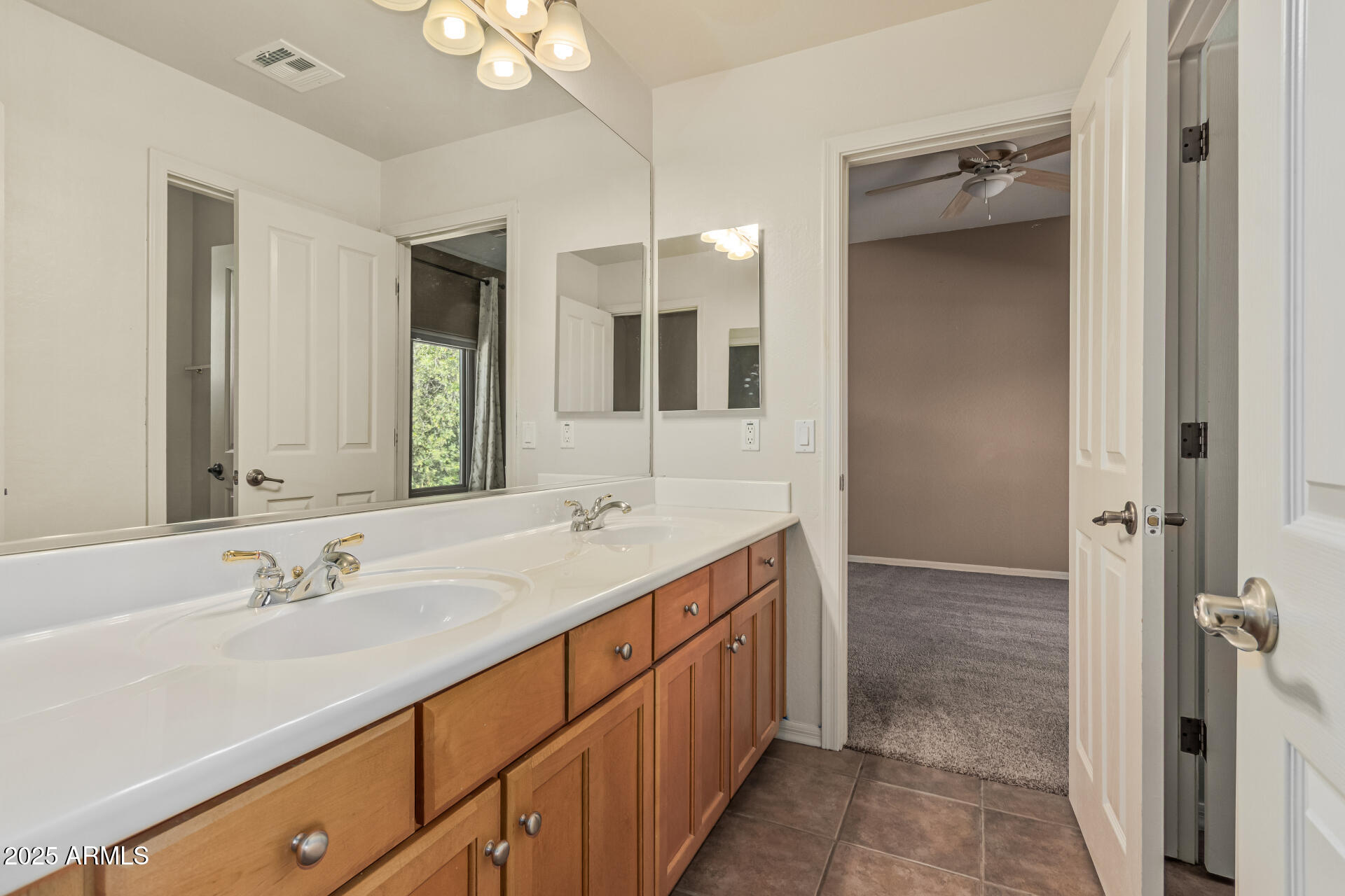5752 South Crossbow Place Chandler, AZ 85249 - Photo 32 of 51 a spacious bathroom with a double vanity sink mirror and shower