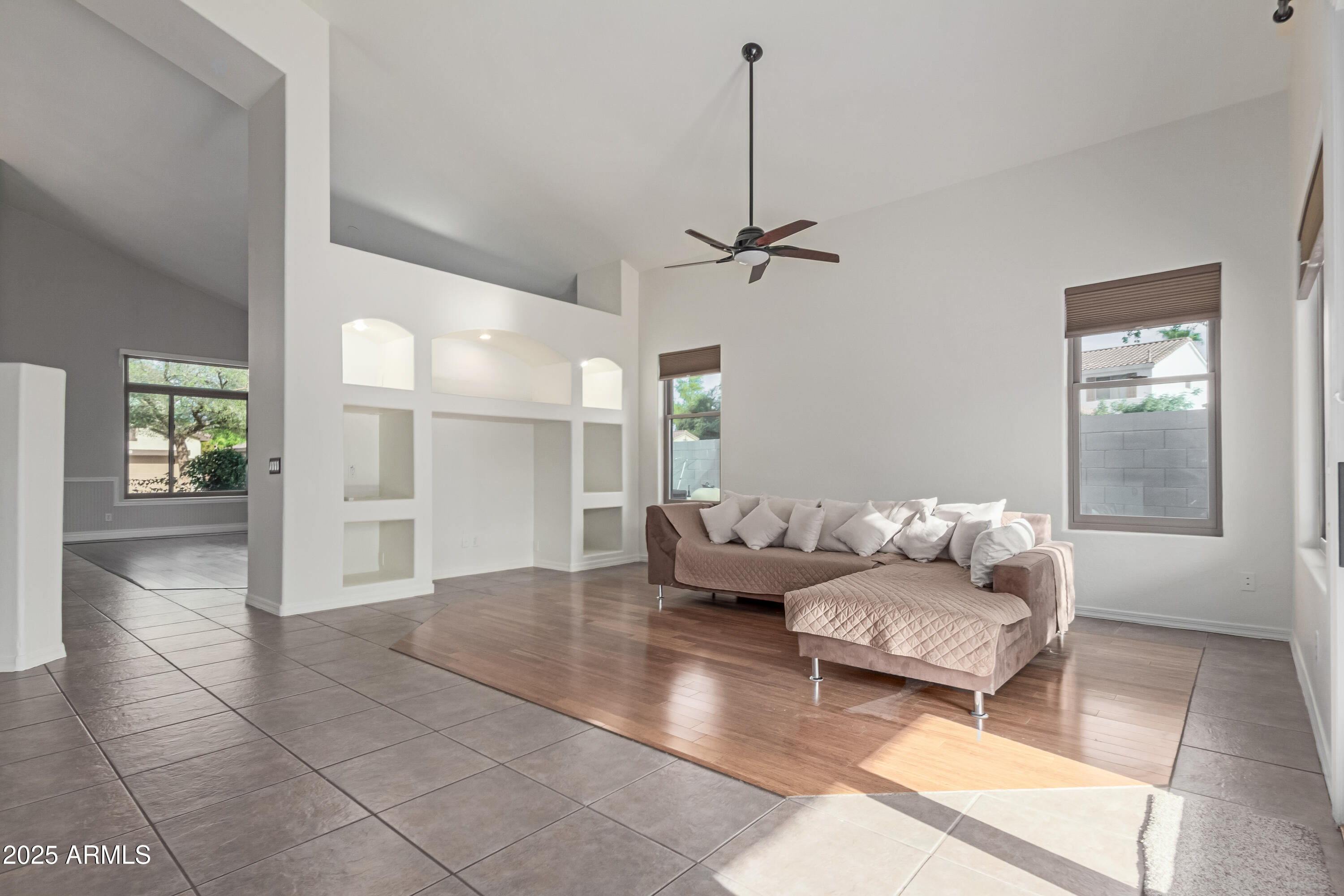 5752 South Crossbow Place Chandler, AZ 85249 - Photo 10 of 51 a living room with furniture and a chandelier