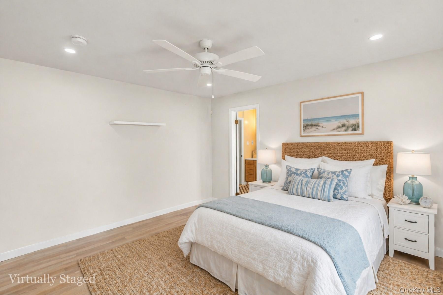 5845 North Bayview Road Southold, NY 11971 - Photo 8 of 26 The main-level bedroom complete with direct ensuite access to the main floor's principal bathroom.