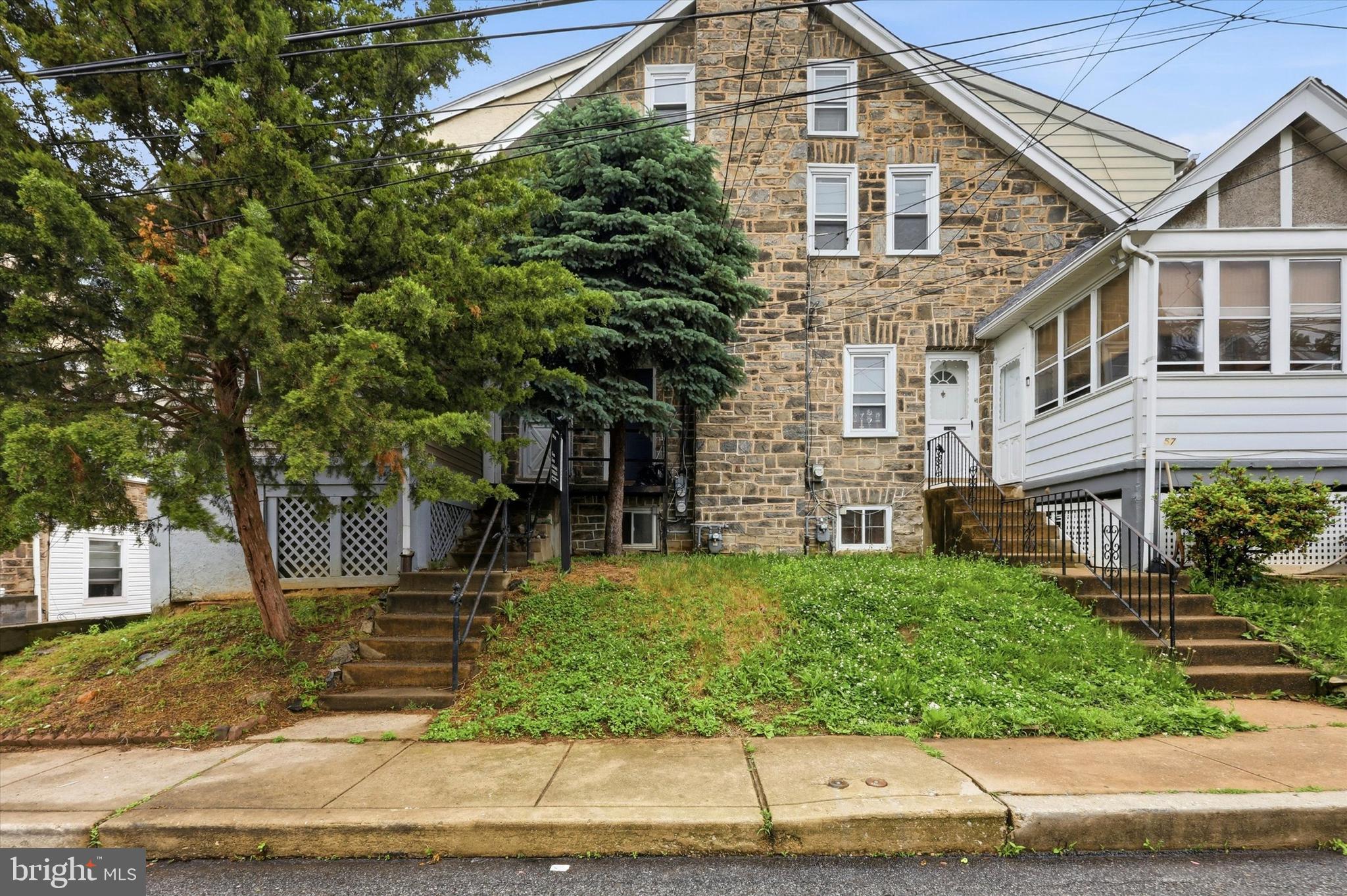 55 Richfield Road Upper Darby, PA 19082 - Photo 1 of 33 front view of a house with a yard