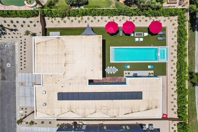 a living room with furniture a rug and a large window