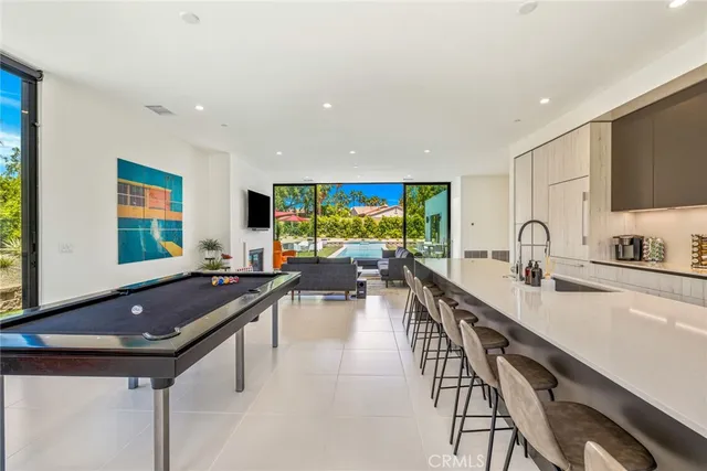 a kitchen with counter top space a sink and appliances