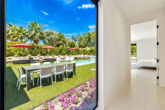 a bedroom with two beds and a window