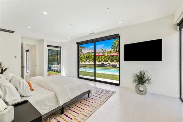 a bathroom with a sink a toilet a mirror and shower