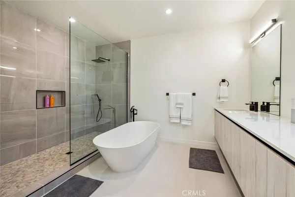 a bathroom with a bathtub and a sink