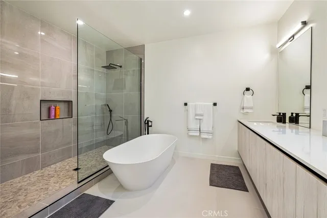 a bathroom with a bathtub and a sink