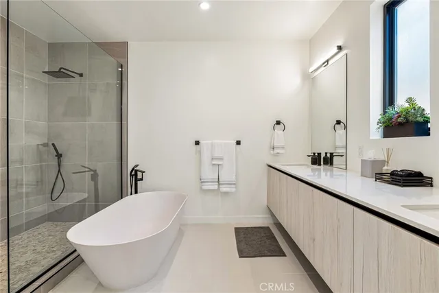 a bathroom with a double vanity sink mirror and toilet