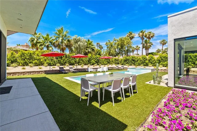 a view of a chairs and table in the patio