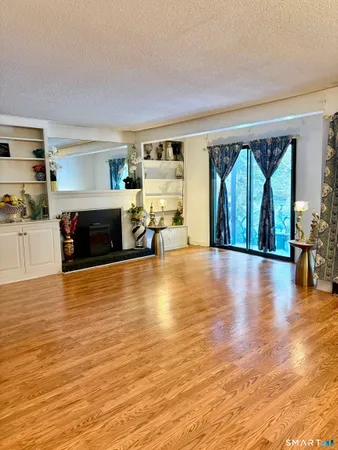 a view of livingroom with furniture window and wooden floor