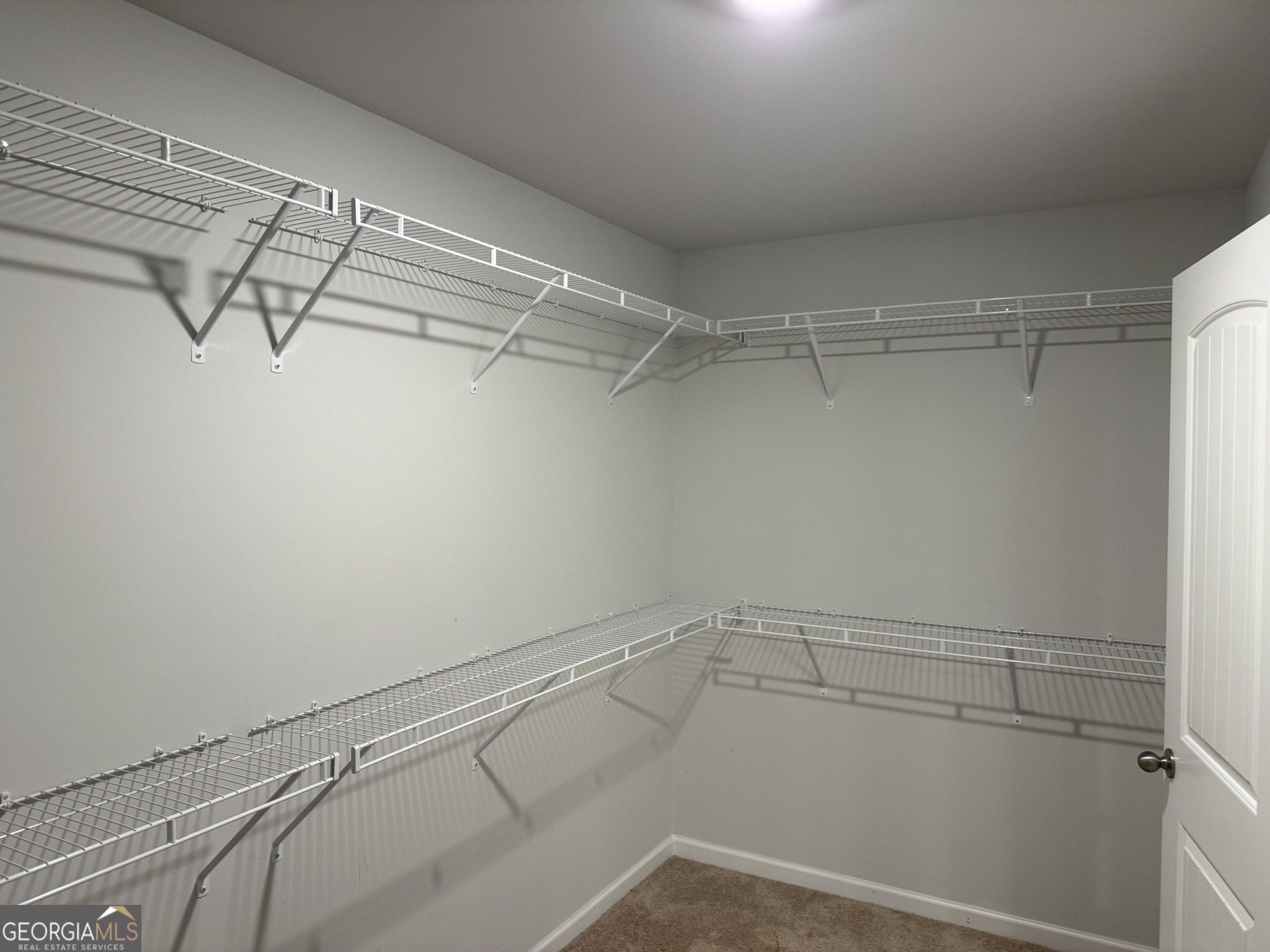 417 Sawmill Trace Hampton, GA 30228 - Photo 16 of 27 a view of a room with racks on the wall