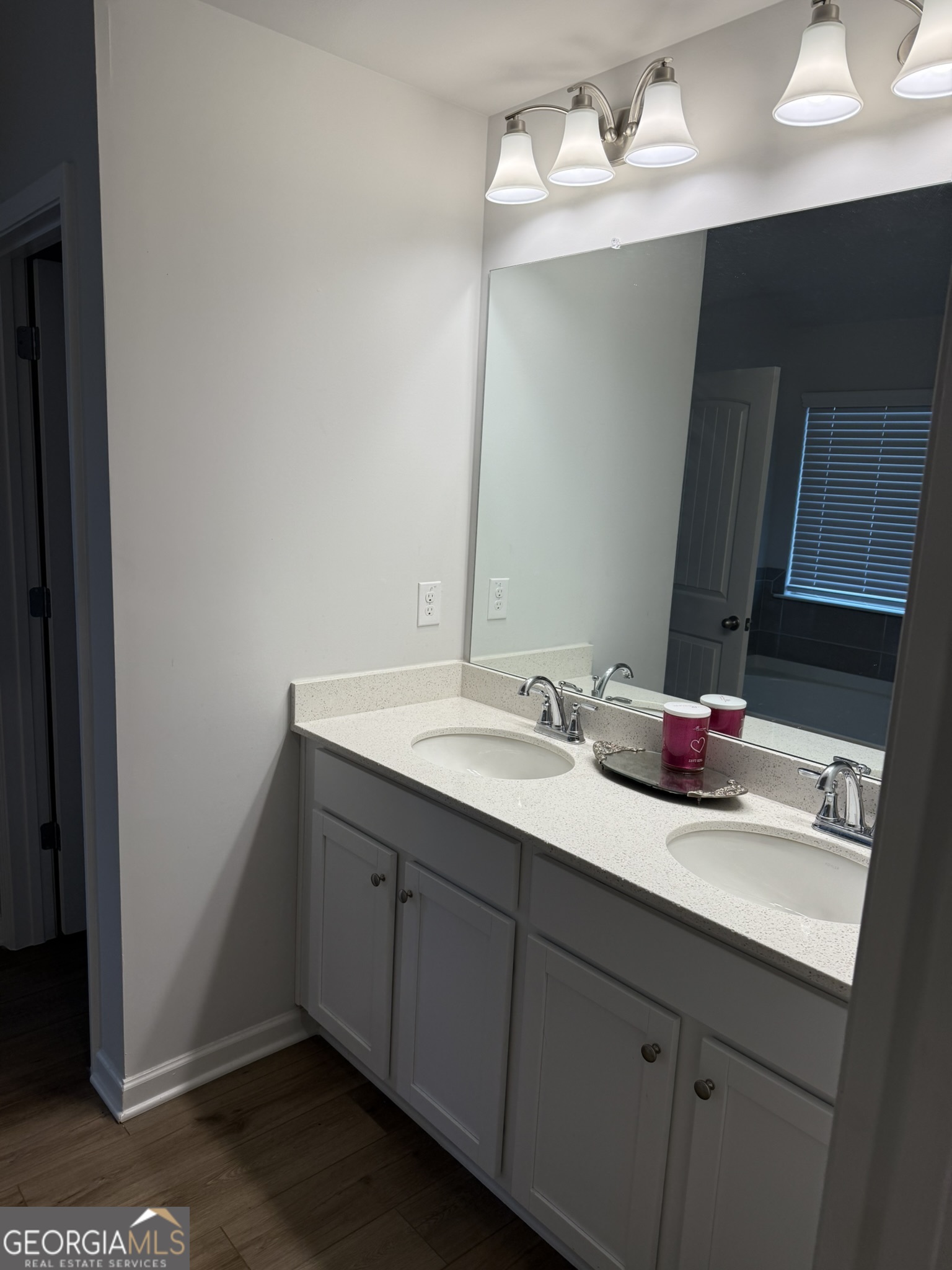 417 Sawmill Trace Hampton, GA 30228 - Photo 17 of 27 a bathroom with a sink and a mirror