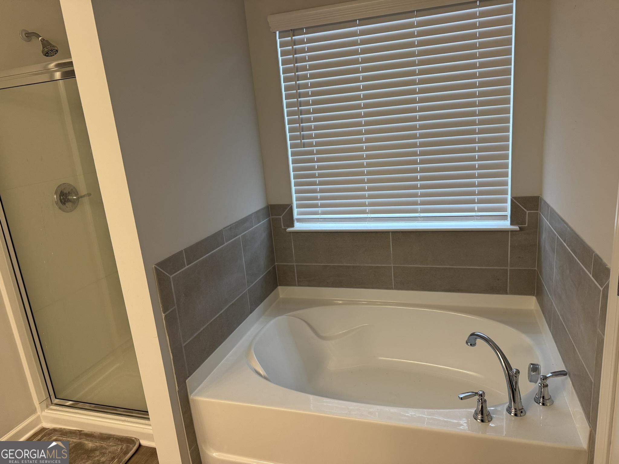 417 Sawmill Trace Hampton, GA 30228 - Photo 18 of 27 a bathroom with a bathtub